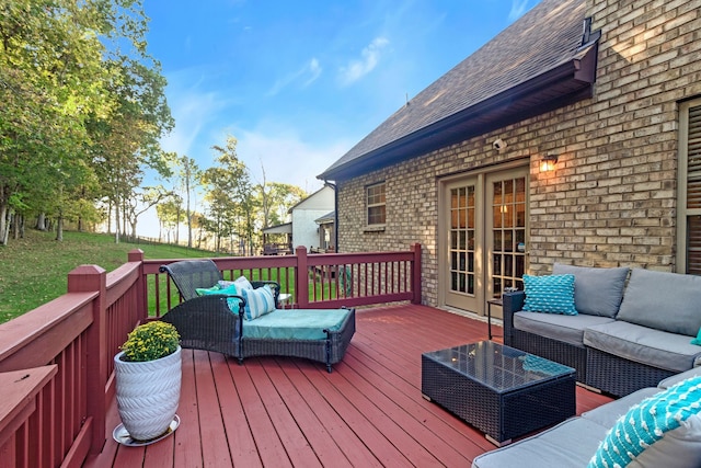 wooden deck featuring french doors, a yard, and outdoor lounge area