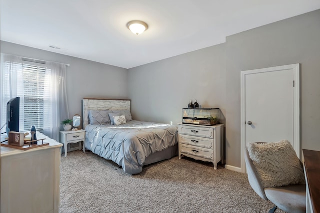 bedroom featuring light carpet