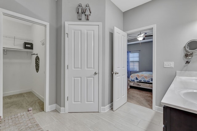 bathroom featuring vanity, tile patterned floors, and ceiling fan