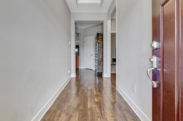 corridor with dark wood-type flooring