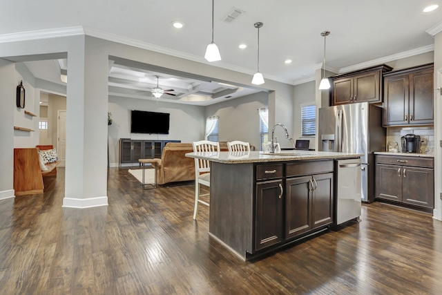 kitchen featuring coffered ceiling, dark wood-type flooring, a center island with sink, dark brown cabinetry, and pendant lighting