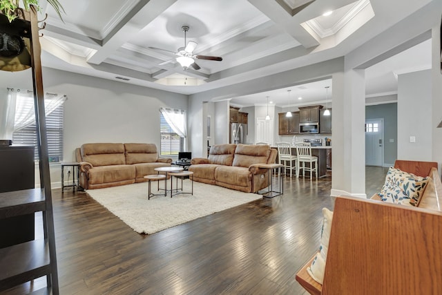 living room featuring crown molding, ceiling fan, coffered ceiling, and dark hardwood / wood-style flooring