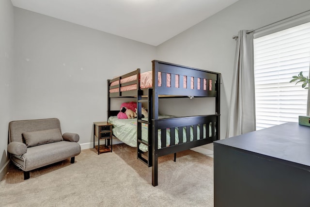 bedroom featuring light colored carpet