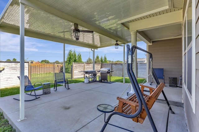 view of patio featuring ceiling fan and a grill