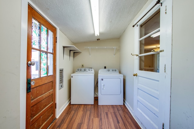 laundry room with dark hardwood / wood-style floors, a textured ceiling, and washing machine and clothes dryer