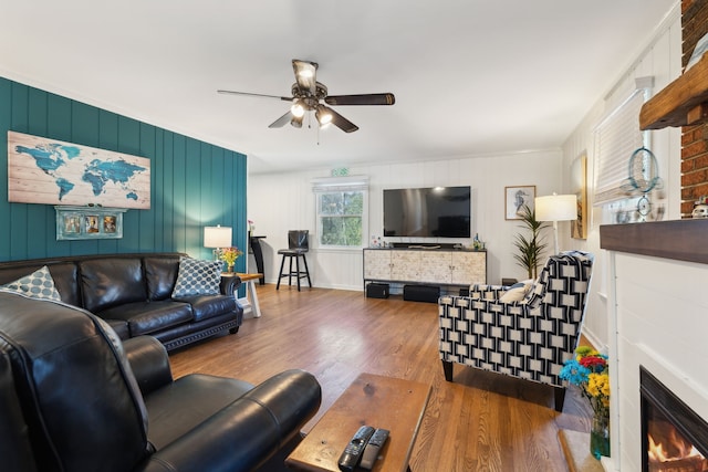 living room with ceiling fan and wood-type flooring