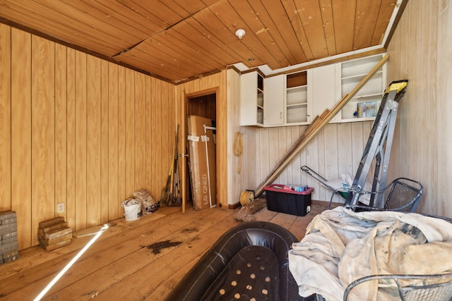 miscellaneous room with hardwood / wood-style flooring, wood ceiling, and wood walls