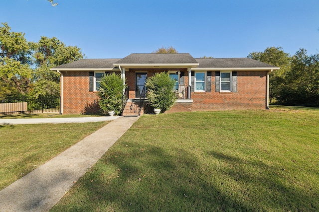 ranch-style home featuring a front yard