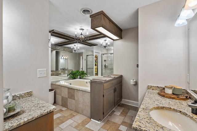 bathroom featuring vanity, a notable chandelier, and shower with separate bathtub