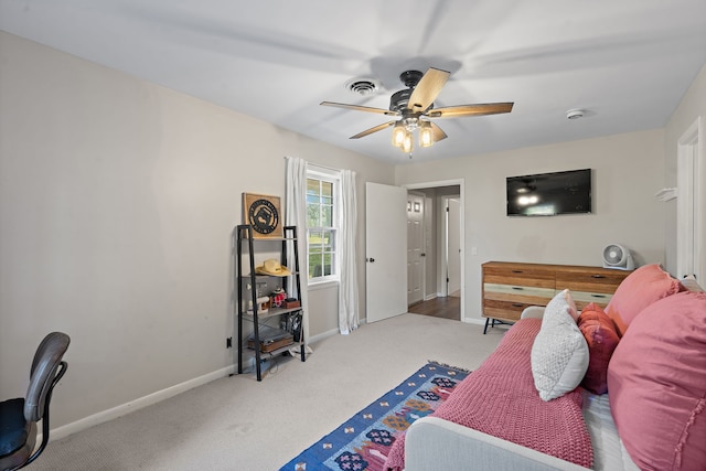 bedroom featuring light carpet and ceiling fan