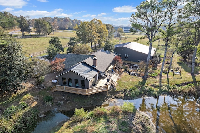 birds eye view of property featuring a water view and a rural view