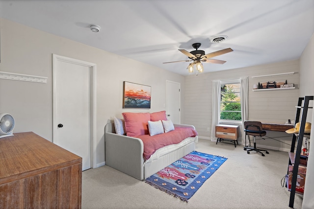 bedroom with ceiling fan and light colored carpet