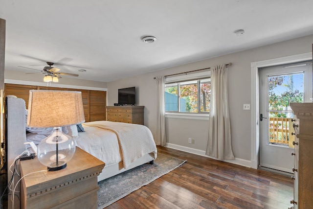 bedroom with ceiling fan and dark hardwood / wood-style flooring