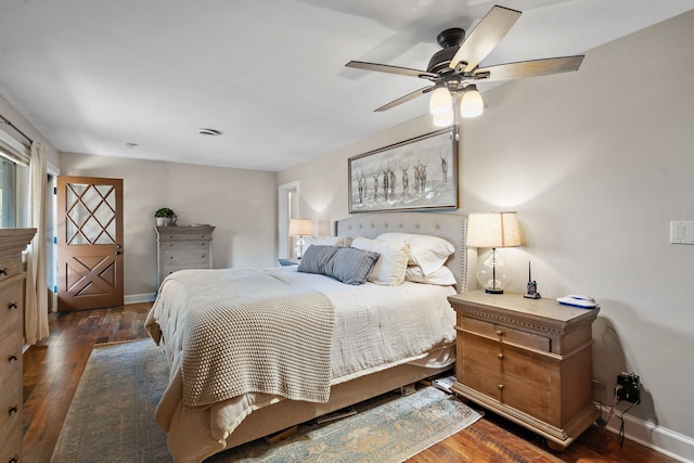 bedroom featuring ceiling fan and dark hardwood / wood-style flooring