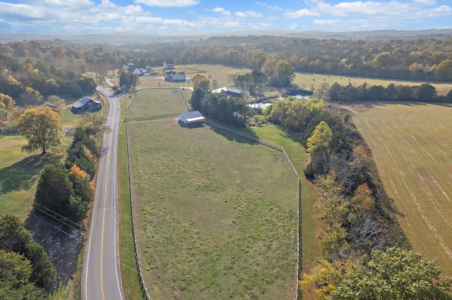 birds eye view of property with a rural view