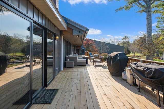 wooden terrace with area for grilling