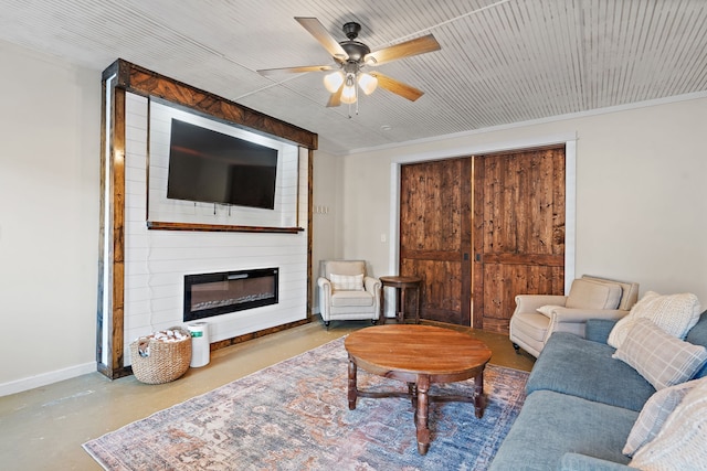 living room featuring ceiling fan, a fireplace, and concrete flooring