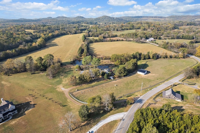 birds eye view of property with a rural view