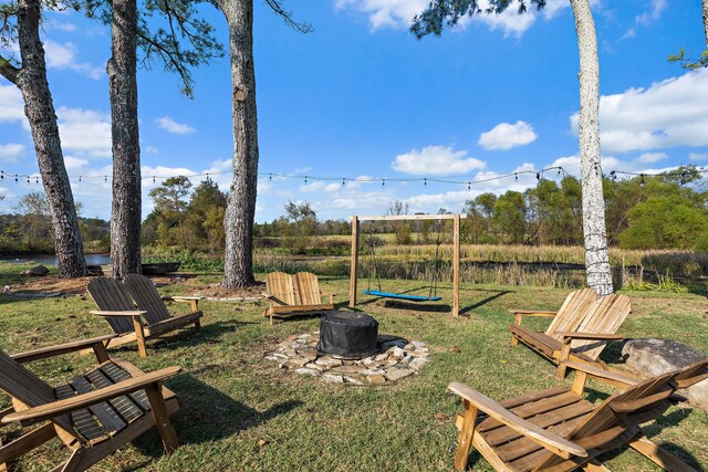 view of yard featuring a fire pit