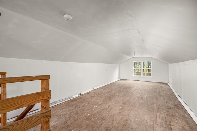 bonus room featuring hardwood / wood-style floors and vaulted ceiling