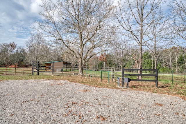 view of yard with a rural view