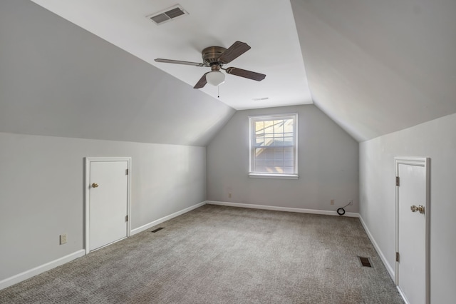 additional living space with ceiling fan, carpet, and vaulted ceiling