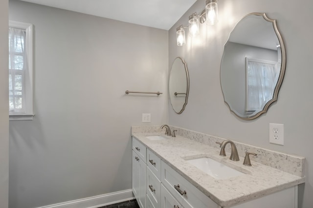 bathroom with vanity and a healthy amount of sunlight