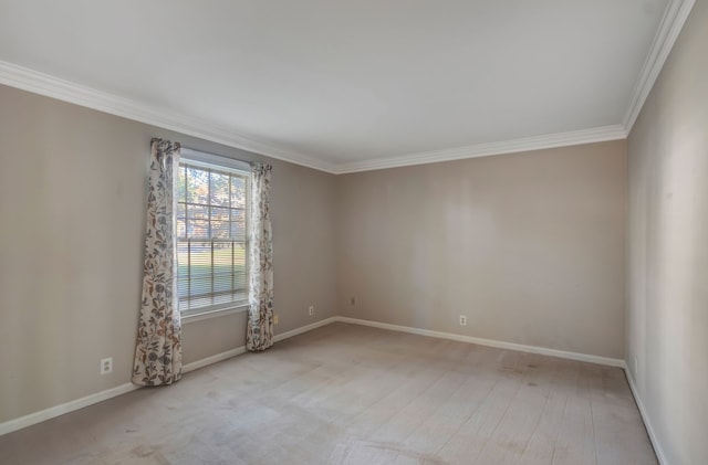 unfurnished room featuring light hardwood / wood-style floors and ornamental molding