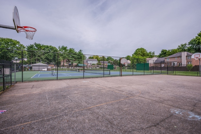 view of basketball court featuring tennis court