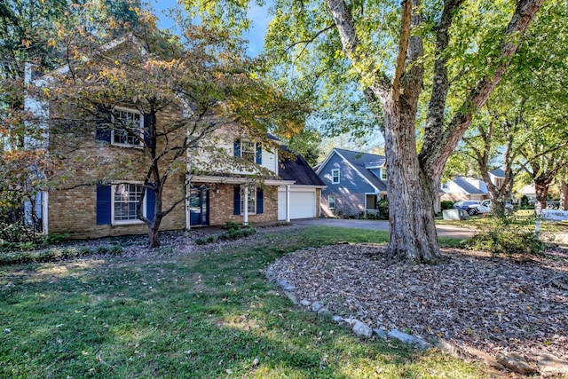 view of front facade featuring a front yard and a garage