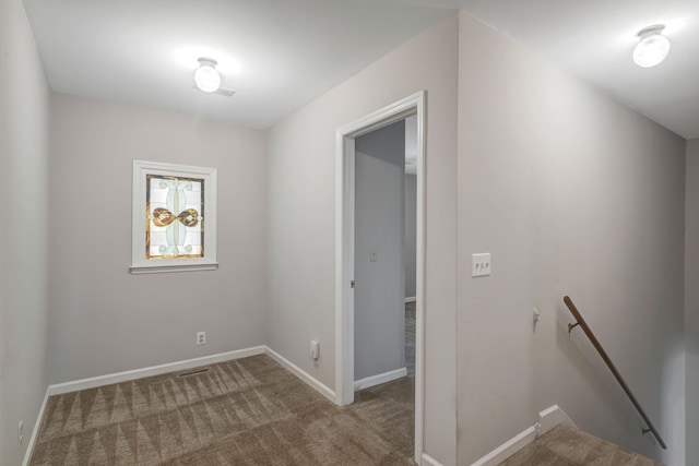 hallway with carpet flooring