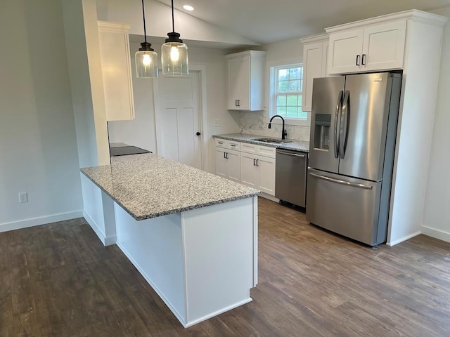 kitchen with white cabinets, sink, and appliances with stainless steel finishes