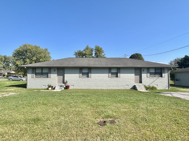 ranch-style home with a front lawn