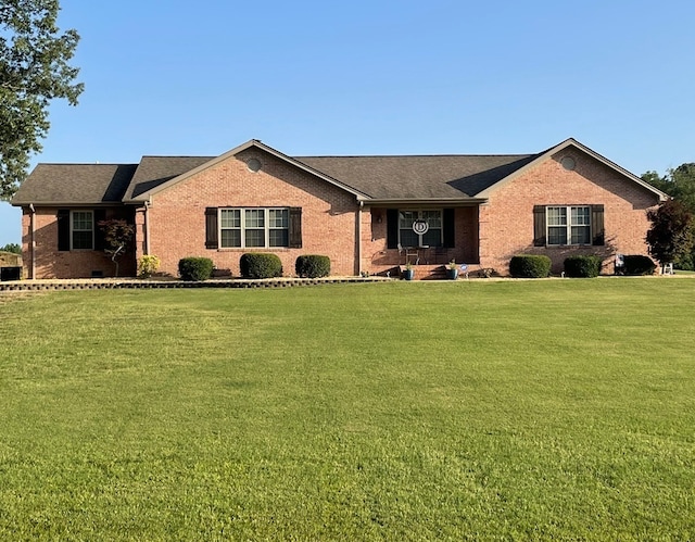 ranch-style house with a front yard