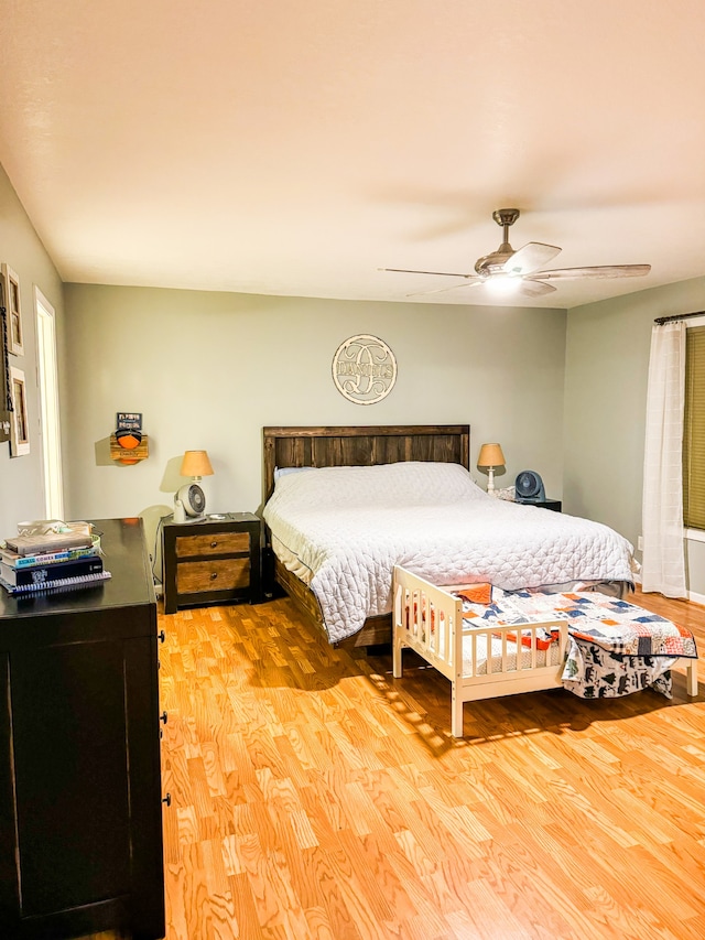 bedroom featuring ceiling fan and hardwood / wood-style flooring