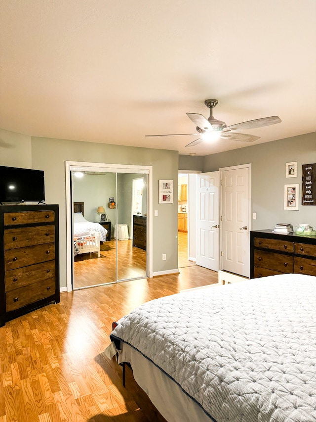 bedroom featuring light wood-type flooring and ceiling fan