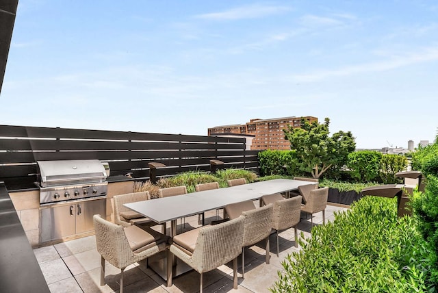 view of patio / terrace featuring area for grilling and a grill