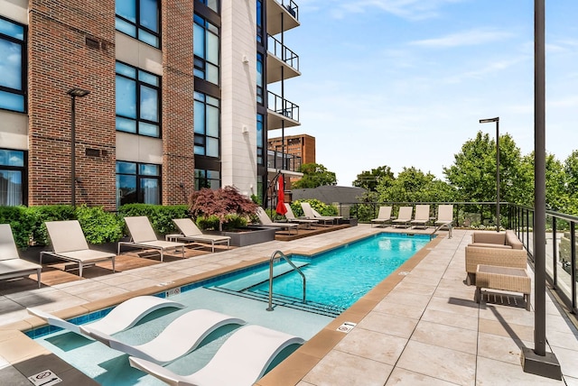 view of swimming pool featuring a patio