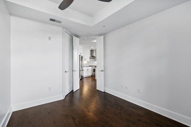 unfurnished room featuring dark hardwood / wood-style floors