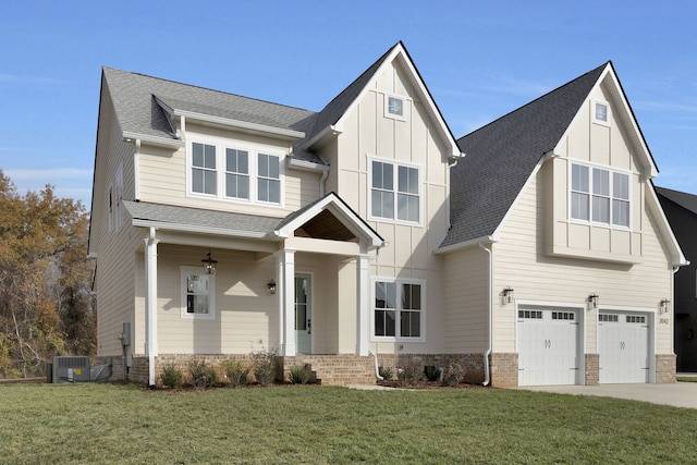 view of front of home with a garage and a front yard