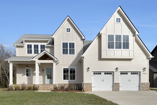 view of front facade with a garage and a front lawn