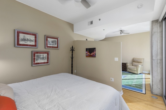 bedroom featuring hardwood / wood-style floors and ceiling fan