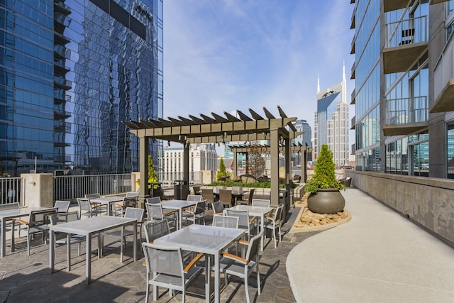 view of patio featuring a balcony and a pergola