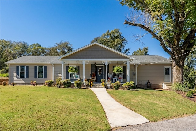 view of front facade with covered porch and a front lawn