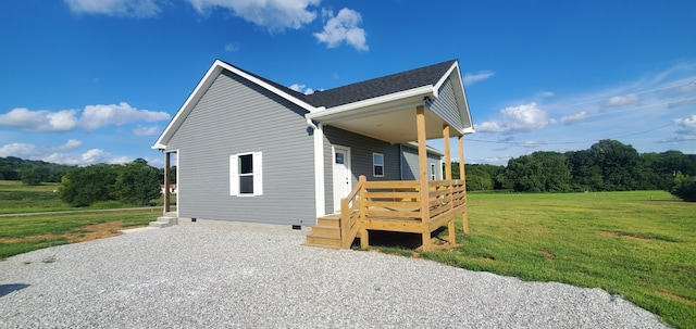 view of property exterior with a yard and a wooden deck