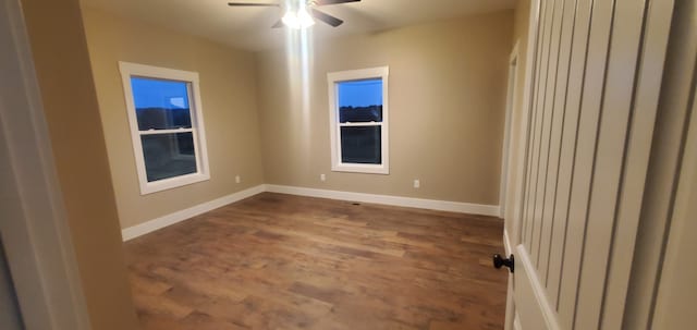 spare room with ceiling fan and hardwood / wood-style flooring