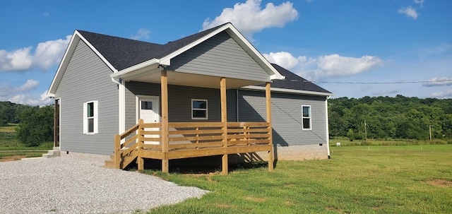 exterior space with a front lawn and a deck