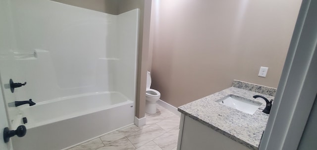 full bathroom featuring washtub / shower combination, vanity, and toilet