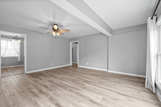 unfurnished bedroom featuring light hardwood / wood-style flooring, beam ceiling, and ceiling fan with notable chandelier