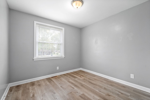 spare room featuring light hardwood / wood-style flooring